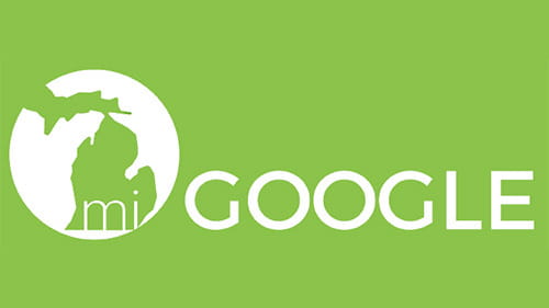 miGoogle logo in bright green with a white Michigan state outline, representing Google’s educational initiative in Michigan.