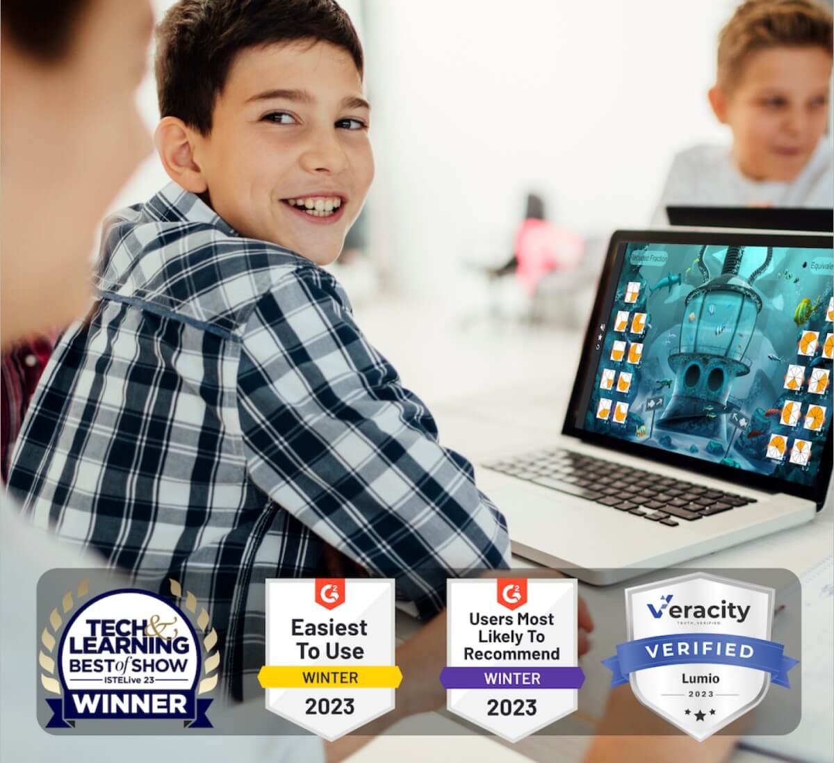 Smiling student engaging with a digital learning platform on a laptop in a classroom setting.