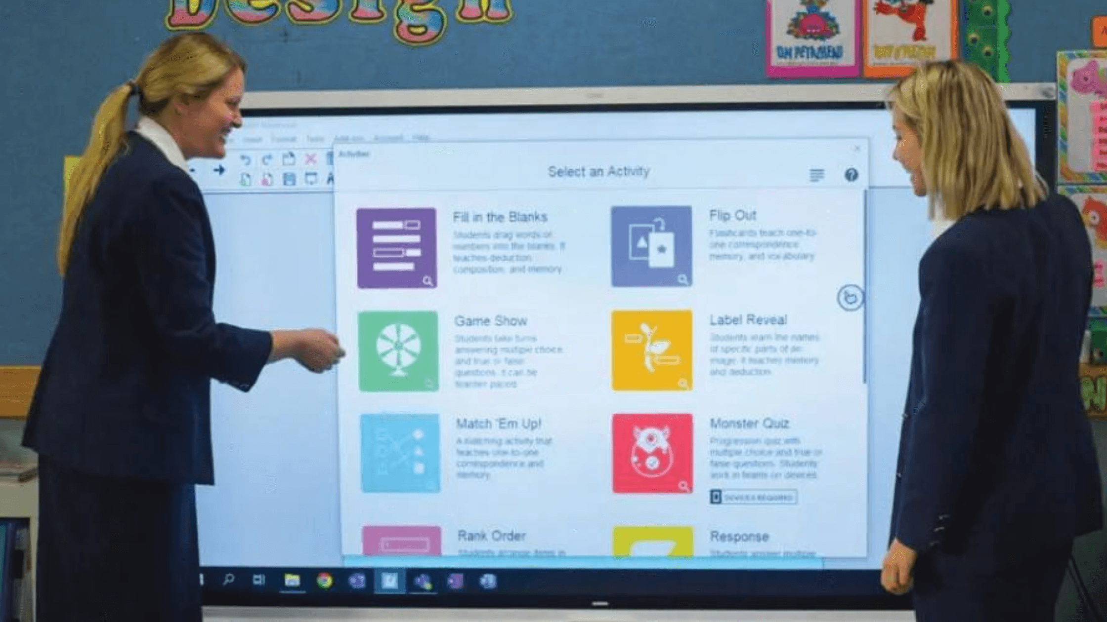Two educators exploring ready-made activities on a SMART Board for education. 