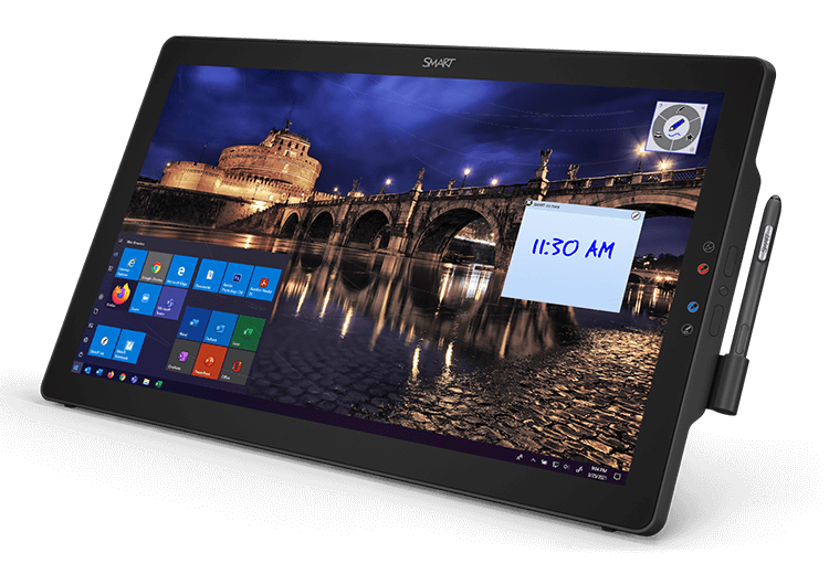 SMART Podium device used in an educational setting, displaying a vibrant night scene of a bridge across a river, complete with user-friendly Windows icons.